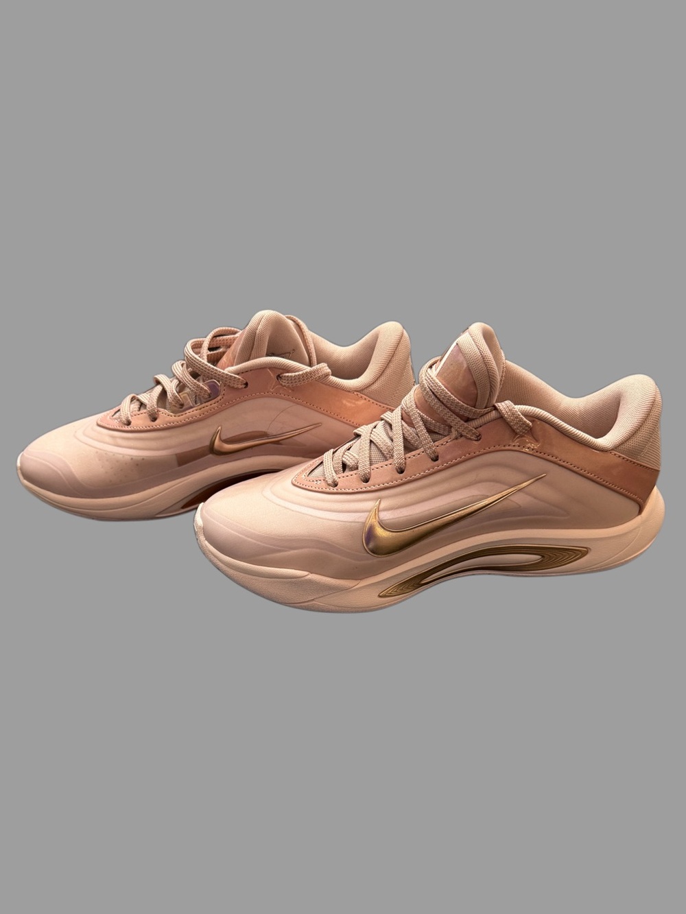 Nike Women's Blush Pink Sneakers with Gold Swoosh